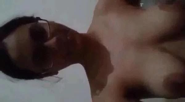 Spectacled Girl Making Her Pussy Squirt With Her Fingers